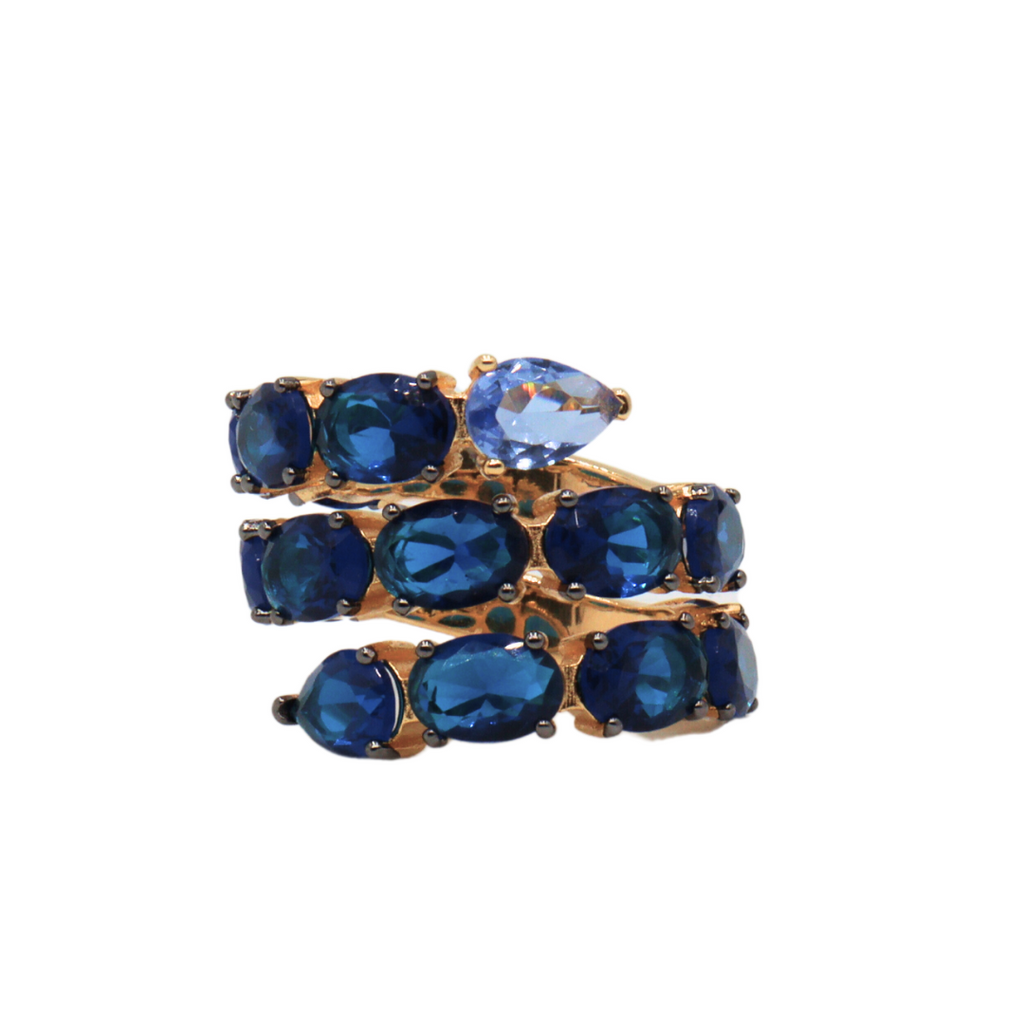 Anillo wrap around de plata 925 con baño en oro amarillo 18k y circonias azules.